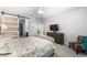 Comfortable bedroom with ceiling fan and barn door leading to a large walk-in closet at 181 Sierra Alta Pl, Henderson, NV 89015