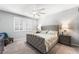 Spacious primary bedroom with modern ceiling fan and bright windows with plantation shutters at 181 Sierra Alta Pl, Henderson, NV 89015