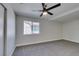 Bedroom with carpet, a ceiling fan, and a window overlooking the yard at 2004 Burnham Ave, Las Vegas, NV 89104