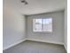 Neutral bedroom featuring carpet, base molding, one window, and smooth walls at 2004 Burnham Ave, Las Vegas, NV 89104