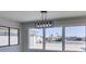 Dining area with modern light fixture and a large window overlooking the neighborhood at 2004 Burnham Ave, Las Vegas, NV 89104