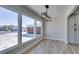 Bright dining area features a modern light fixture and expansive windows at 2004 Burnham Ave, Las Vegas, NV 89104