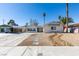 Charming single-story home with rock landscaping and a covered parking space at 2004 Burnham Ave, Las Vegas, NV 89104