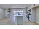 Contemporary kitchen showcasing white cabinets, stainless steel appliances, and center island with ample counter space at 2004 Burnham Ave, Las Vegas, NV 89104