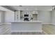 Well-lit kitchen featuring an oversized island, modern cabinets, and stainless steel microwave at 2004 Burnham Ave, Las Vegas, NV 89104