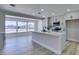 Stylish kitchen with white cabinets, stainless steel appliances, and a center island, perfect for cooking and entertaining at 2004 Burnham Ave, Las Vegas, NV 89104