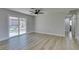 Bright living room with wood-look floors and sliding glass doors that lead to the backyard at 2004 Burnham Ave, Las Vegas, NV 89104