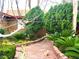 Lush desert landscaping and brick pathway create a tranquil retreat at 2229 Windsor Dr, Henderson, NV 89014