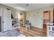 Sunlit bedroom with wood floors, neutral walls, and adjacent bathroom and closet at 2504 Cove Rd, Las Vegas, NV 89128