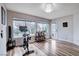 Bright bonus room with wood-look floors, exercise bike, and large windows providing lots of natural light at 2504 Cove Rd, Las Vegas, NV 89128