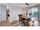 Dining room features modern lighting and a patio view at 2504 Cove Rd, Las Vegas, NV 89128