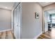 Hallway with long closet space and wood-look flooring at 2504 Cove Rd, Las Vegas, NV 89128