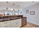 Kitchen with stainless steel appliances, breakfast bar and sleek countertops at 2504 Cove Rd, Las Vegas, NV 89128