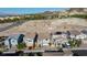 Scenic aerial view of a neighborhood featuring well-maintained homes and desert landscaping at 26 Lilla Rosa St, Henderson, NV 89011