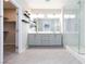 Bright bathroom featuring double vanity, sleek fixtures, and a frameless glass walk-in shower at 26 Lilla Rosa St, Henderson, NV 89011