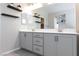 Bright bathroom featuring double vanity, sleek fixtures, and modern decor at 26 Lilla Rosa St, Henderson, NV 89011