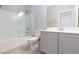 Bathroom with tub-shower combo, gray vanity and tile flooring at 26 Lilla Rosa St, Henderson, NV 89011