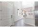 Bright foyer showcasing neutral walls, tile flooring, a modern staircase railing, and an open floor plan with lots of light at 26 Lilla Rosa St, Henderson, NV 89011