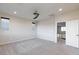 Main bedroom with carpet, a ceiling fan, and view of the hallway at 26 Lilla Rosa St, Henderson, NV 89011