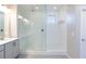 Modern shower with glass enclosure, a rainfall showerhead, and ample natural light at 26 Lilla Rosa St, Henderson, NV 89011