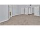 Spacious carpeted bedroom with multiple closets and neutral tones at 2638 Douglas Cir, Henderson, NV 89074