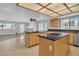 Open-concept kitchen with granite countertops island and view of the living area at 2638 Douglas Cir, Henderson, NV 89074