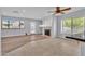 Bright living room with modern ceiling fan, cozy fireplace, and lots of natural light at 2638 Douglas Cir, Henderson, NV 89074