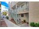 Condominium with exterior staircase, sidewalk, and minimal landscaping at 2725 S Nellis Blvd # 2179, Las Vegas, NV 89121