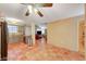 Open floorplan showing the kitchen and living areas with terracotta tile flooring and neutral walls at 2725 S Nellis Blvd # 2179, Las Vegas, NV 89121