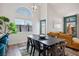 Open concept dining room with a large table and bright light at 306 Rodarte St, Henderson, NV 89014