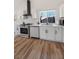 Well-lit kitchen with stainless steel appliances, white countertops, and modern cabinetry at 306 Rodarte St, Henderson, NV 89014