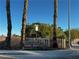 A welcoming community entrance with the 'Tapatio II' sign displayed on a stone wall, framed by palm trees at 379 Rosado Springs St, Henderson, NV 89014