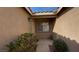 Front entryway with desert landscaping and tile roof in courtyard at 379 Rosado Springs St, Henderson, NV 89014