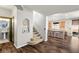 Welcoming entryway with hardwood floors, stairs, and an open view into the adjacent kitchen at 3938 E Chaffe Ave, Pahrump, NV 89061