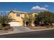 Two-story home featuring desert landscaping, a two-car garage, and a well-maintained front yard at 3938 E Chaffe Ave, Pahrump, NV 89061