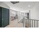 Bright and airy hallway with bookshelves, ample lighting, and neutral decor at 3938 E Chaffe Ave, Pahrump, NV 89061