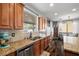 Well-lit kitchen with granite counters, stainless appliances, and a view to the backyard at 3938 E Chaffe Ave, Pahrump, NV 89061