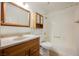 Bathroom features a sink, toilet, vanity and a shower-tub combo at 4032 Rustic Oak Ct, North Las Vegas, NV 89032