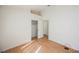 Bedroom featuring vaulted ceilings, white trim, and wood-look flooring at 4032 Rustic Oak Ct, North Las Vegas, NV 89032