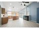 Open kitchen with center island, tile flooring, and a cozy fireplace at 4032 Rustic Oak Ct, North Las Vegas, NV 89032