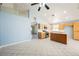 Bright kitchen with an island, stainless steel appliances, tile floors and light-colored wood cabinets at 4032 Rustic Oak Ct, North Las Vegas, NV 89032