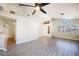 Open-concept living room with new laminated flooring, high ceilings, and large windows at 4032 Rustic Oak Ct, North Las Vegas, NV 89032