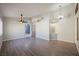 Bright and airy living room with laminated flooring, modern lighting fixtures, and a seamless flow into other living areas at 4032 Rustic Oak Ct, North Las Vegas, NV 89032