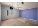 Bright main bedroom with carpet, ceiling fan and a window letting in lots of natural light at 4032 Rustic Oak Ct, North Las Vegas, NV 89032