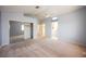 Large main bedroom with carpet, ceiling fan, closet and an en suite bathroom with double sinks at 4032 Rustic Oak Ct, North Las Vegas, NV 89032