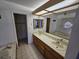 Bright bathroom featuring a jacuzzi tub and single sink vanity at 4055 Nook Way # A, Las Vegas, NV 89103