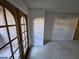 Carpeted bedroom featuring a light-filled room with a standard door, as well as patio access with glass paneled doors at 4055 Nook Way # A, Las Vegas, NV 89103