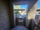 Charming entryway with stucco walls leading to covered parking and complex grounds at 4055 Nook Way # A, Las Vegas, NV 89103