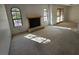 Bright living room features a fireplace, arched windows, and access to a sliding glass door at 4055 Nook Way # A, Las Vegas, NV 89103