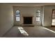 Bright living room features a fireplace and arched windows for a cozy atmosphere at 4055 Nook Way # A, Las Vegas, NV 89103